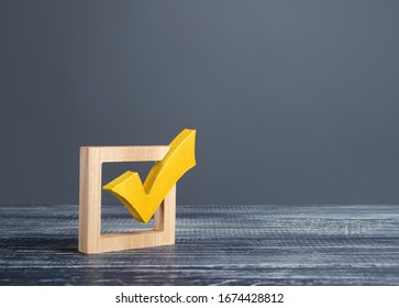 Yellow voting tick in a checkbox. Democratic institutions, vote on democratic elections, referendum. Opinion Poll. Make right choice. Confirmation, passing the test. Verification. Law implementation