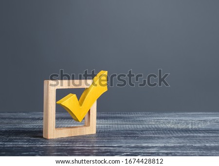 Yellow voting tick in a checkbox. Democratic institutions, vote on democratic elections, referendum. Opinion Poll. Make right choice. Confirmation, passing the test. Verification. Law implementation