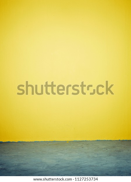 yellow wall, background and layout,An object in\
front of a yellow wall