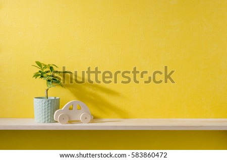 yellow wall and shelf