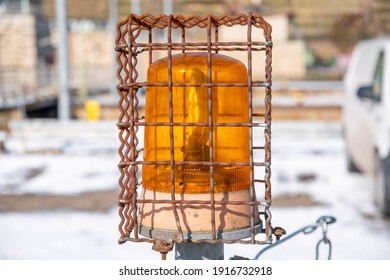 Yellow Warning Light Protected In Wire Cage