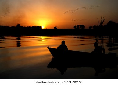 Yellow Water In Australia Kakadu National Park Sunset Over The River With People In Boat Peaceful And Picturesque Landscape In Northern Territory