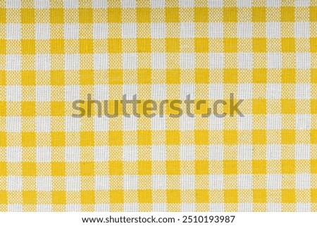 Yellow and white checkered, pattern, design, cotton fabric for sewing, texture background close-up