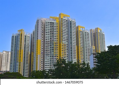 Yellow And White HDB Apartment Blocks In Singapore. 