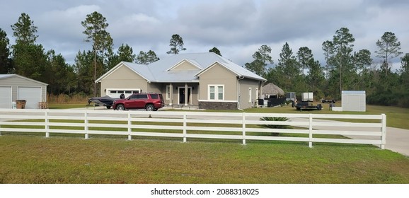 Yellow and white newly constructed home real estate in North Florida December 7 2021 Starke Florida United States