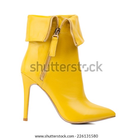 Yellow women boot isolated on white background.