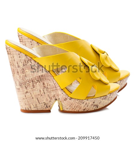 Yellow women shoe isolated on white background.
