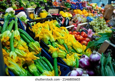 Yellow Zucchini Flowers And Other Fresh Vegetables For Sale On Farmers Market In Florence, Tuscany, Italy, Food Background