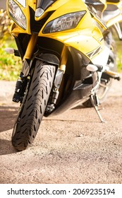 Yellow-black sports motorcycle stands on the bandwagon on a sunny day - Shutterstock ID 2069235194