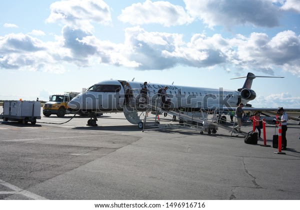 Yellowknife,Canada-August\
28, 2019: Airplane, tarmac, parking apron and terminal building of\
Yellowknife airport, Canada\
\
