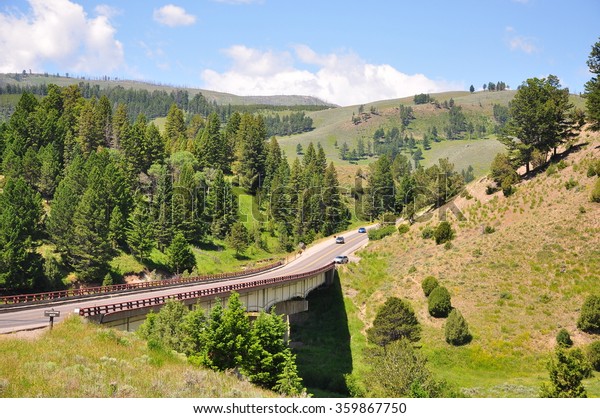 YELLOWSTONE NATIONAL PARK, USA - June 25 : Road\
across Yellowstone river in Yellowstone National Park, Wyoming, USA\
 on June 25, 2015