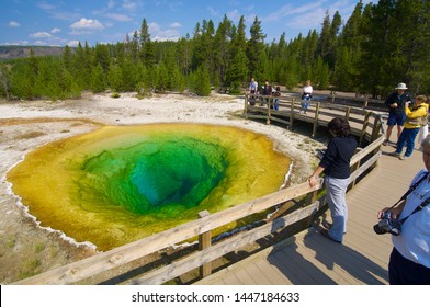 Yellowstone, Usa - August 19, 2007: Several Tourists Come To Photograph The Morning Glory.