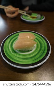 Yellowtail Nigiri On A Green Plate