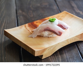 Yellowtail Nigiri Sushi. Japanese Sushi On A Sushi Wooden Tray.