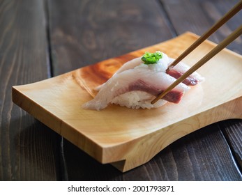 Yellowtail Nigiri Sushi. Japanese Sushi On A Sushi Wooden Tray.