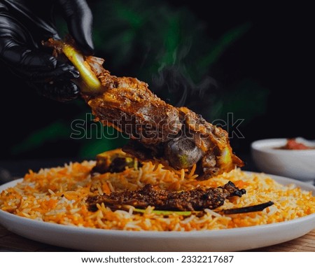 Yemeni mandi rice surf with meat or chicken . Yemen food kabsa mandi 
