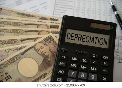 Yen money depreciation concept. depreciation word on calculator with yen money and monetary policy Yen depreciates report.