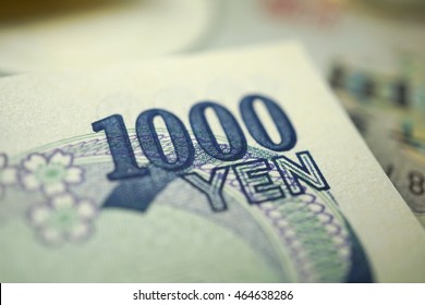 yen notes and yen coins for finance concept background