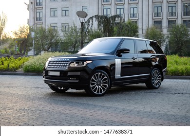 Yerevan, Armenia - 10 August 2019.
Dark Black Luxury Range Rover Autobiography Standing On The Car Parking From Different Sides With Buildings And Trees On The Background.