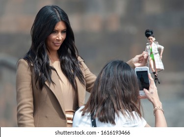 YEREVAN, ARMENIA - APRIL 09, 2015 U.S. Reality TV Star Kim Kardashian Poses With A Hand Made Toy Of Her For The Girl Who Made The Toy