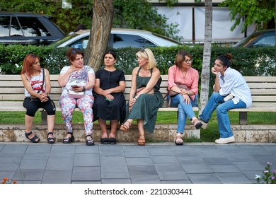 Yerevan, Armenia - August 15, 2021: Armenian Women Sitting At The Bench In The Park