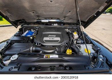 Yerevan, Armenia - June 02, 2019: Engine Compartment With V6 Motor Of Black Jeep Wrangler Unlimited Sahara 4x4 SUV Under The Raised Hood 