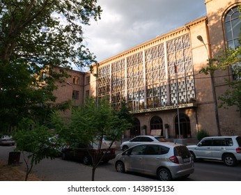 YEREVAN, ARMENIA - MAY 28, 2019:  View Of Komitas State Conservatory Of Yerevan At Golden Hour On A Summer Evening. Sign Translation -  Komitas State Conservatory Of Yerevan. 