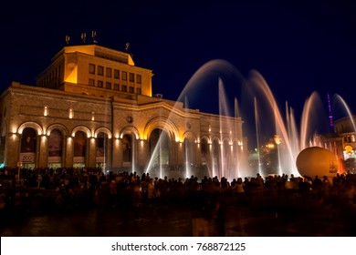 Yerevan, Republic Square, Armenia - October 14, 2017: Colored singing musical dancing fountains against the building of the National Gallery and History Museum of Armenia. Beautiful night cityscape