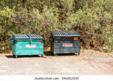 Yermo, CA, USA – April 24, 2021: Two Commercial Dumpster Placed In A Remote Area In Mojave Desert Town Of Yermo, California.  
