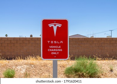 Yermo, CA / USA – August 1, 2020: A Tesla Vehicle Charging Only Sign In Red And White For A Charging Station Located Off Of Interstate 15 In Yermo, California. 
