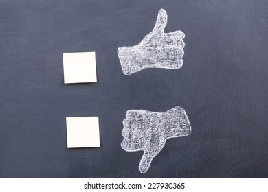 Yes Or No? Blackboard Drawing Of Thumbs Up And Down With Adhesive Notes Near Them