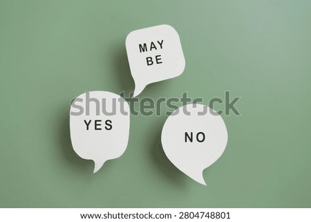 yes, no and maybe text on real white speech bubble paper cut with green background