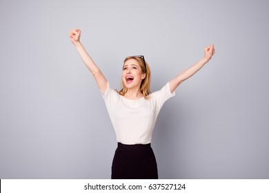 Yes! Pretty Extremely Happy Woman Celebrating Her Success With Raised Hands