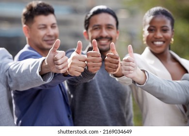 Its A Yes From Us. Portrait Of A Group Of Businesspeople Showing A Thumbs Up Outside.