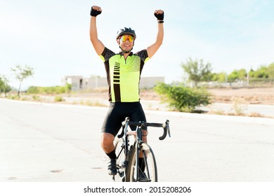 Yes, I won! Excited male athlete putting his arms in the air after winning a race. Happy cyclist broke his own record - Powered by Shutterstock