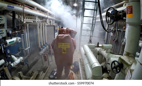 YESUD HAMAALA ISRAEL, MARCH 21, 2016: Firefighters Practice Sealing Of Leak Accident From Corrosive Toxic Hazardous Material Ammonia Liquid Container In Fruit Factory Dressing Protective Suites.