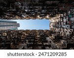 Yick Fat Building, Quarry Bay, Hong Kong. Residential area in old apartment with windows. High-rise building, skyscraper with windows of architecture in urban city.