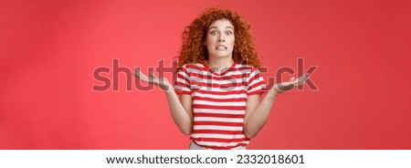 Yikes how should I know. Unaware worried awkward cute redhead curly girl clench teeth smirking uncertain panic cannot answer popping eyes confused shrugging hands spread sideways full disbelief.