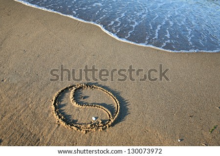 Yin Yang on the beach