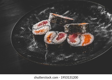 Yin Yang Sushi Roll With Tuna And Salmon On Plate