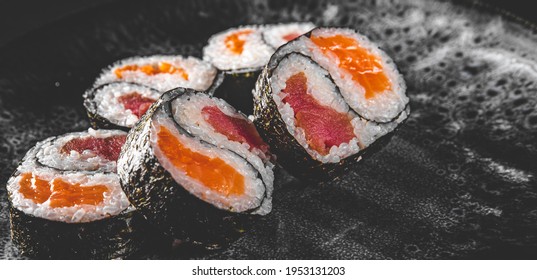 Yin Yang Sushi Roll With Tuna And Salmon On Plate