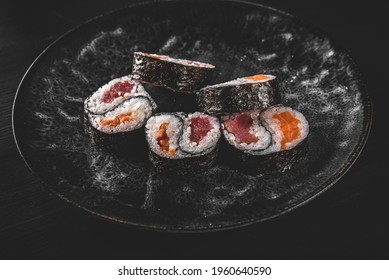 Yin Yang Sushi Roll With Tuna And Salmon On Plate