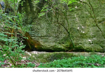 ying-yang carved in sandstone rock, Central Bohemia, Czech Republic