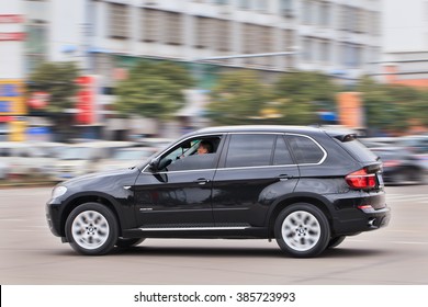 YIWU-CHINA-JAN. 15, 2016. BMW X5 3.5i On The Road. BMW Sales Will Be Hit In 2016 By Cut-throat Competition, Slowing Chinese Economy And The Government Crackdown On Graft And Conspicuous Consumption.