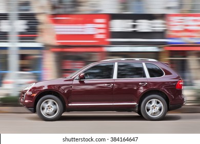 YIWU-CHINA-JAN. 19, 2016. Purple Porsche Cayenne. Since 2010, Porsche Has Tripled Sales In China. But After Government Crackdown On Graft And Conspicuous Consumption, The Luxury-car Sales Is Slowing.