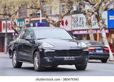 YIWU-CHINA-JAN. 7, 2016. Black Porsche Cayenne. Since 2010, Porsche Has Tripled Sales In China. But After Government Crackdown On Graft And Conspicuous Consumption, The Luxury-car Sales Is Slowing. 