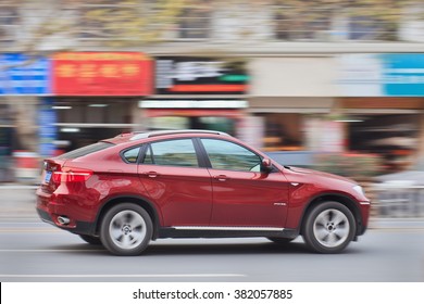 YIWU-CHINA-JANUARY 15, 2016. BMW X6 3.5i On The Road. BMW Sales Will Be Hit In 2016 By Cut-throat Competition, Slowing Chinese Economy And Government Crackdown On Graft And Conspicuous Consumption.