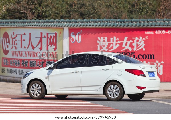 YIWU-CHINA-JANUARY 26, 2016. White Hyundai Accent on the\
street. Hyundai car sales in China increased 11.2 percent in 2015,\
keeping an upward trend for the succeeded top carmaker from South\
Korea. 