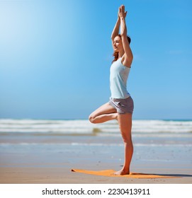Yoga, beach and woman stretching on blue sky mockup for mindset wellness, peace and calm in nature fitness. Healthy, pilates and balance on legs or tree pose for spiritual, healing or exercise by sea