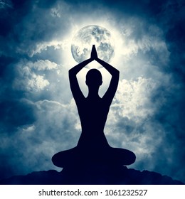 Yoga Body Pose Silhouette Over Moon Night Sly, Mindfulness Meditation Exercise In Prayer Position
